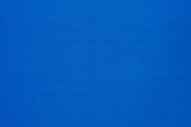 Polyester malzemeden yapılmış canlı, açık mavi düz kumaş dokusu. Açık mavi tonda kumaş arkaplan.