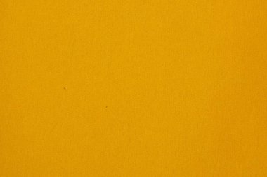 Pamuktan yapılmış sarı düz kumaş, yıllarca kullanılacak deliklerle örülmüş. Sarı tonda kumaş arkaplan.