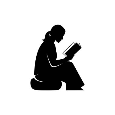 Silhouette of a woman reading a book while sitting on the floor