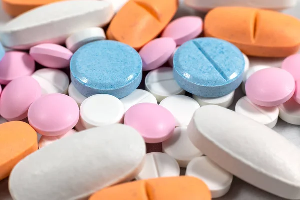 Multicolored pills on the table