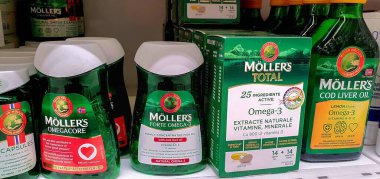 Moller`s tran omega-3 Norwegian fish oil products in a pharmacy,selective focus