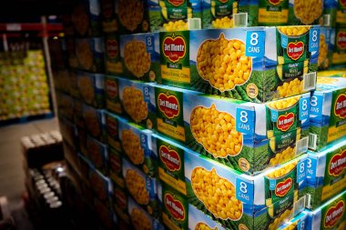 Close view of bulk boxes of Del Monte Foods canned corn inside a Sam's Club grocery store in Albuquerque, NM, USA