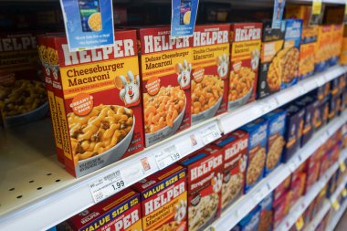 Boxes of Hamburger Helper in the flavor of cheeseburger macaroni on the shelves inside a Smith's grocery store in Albuquerque, NM, USA