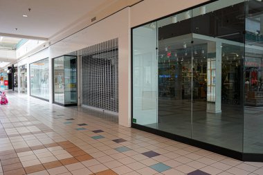 Abandoned empty storefront, previously a Forever 21 clothing store, inside the Cottonwood Mall in Albuquerque, NM, USA