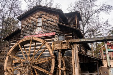 Close view of the Grist Mill building in the Dollywood theme park with a sign saying 