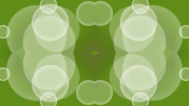 Dinamik, döngüsel bir hareketle bir dizi yeşil bokeh daireleri içeren büyüleyici soyut bir video.