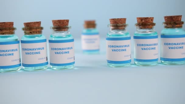 Coronavirus medication. Coronavirus covid-19 vaccine. A glass vial of covid-19 — Stock Video