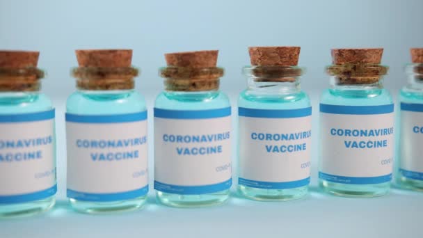 Lot of jars medical preparation for corona virus. Ready-made doses injection. — Stock Video