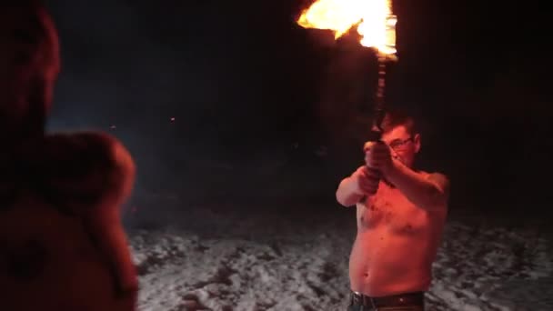Battle evil aggressive viking warrior in northern tattoos burning fire swords — Stock Video