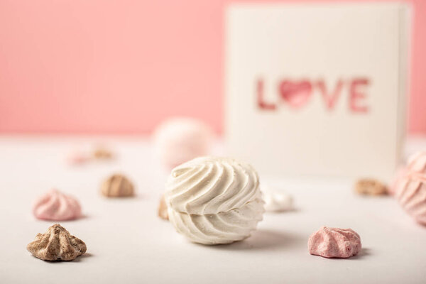 Gift box with the inscription Love and sweets on a pink background. Valentine's Day gift concept. Narrow focus. Banner.