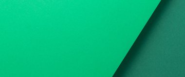 Yeşil karton arka plan tasarımı geometrik olarak katlanmıştı. Üst manzara, düz yatış. Pankart. 