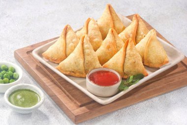 fried chicken and vegetables on wooden table