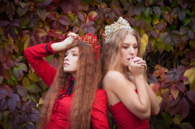 Russian girls are beautiful. Russian national traditions. Sisters in crowns. Wives from abroad. Girlfriends in red dresses. Fairy princesses. clipart