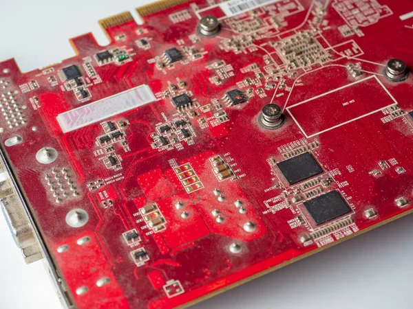 dusty printed circuit Board with red chips. Old video card