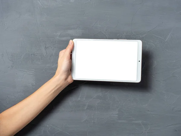 Woman Hand Holds White Tablet Gray Textured Background Place Insert — Stock Photo, Image