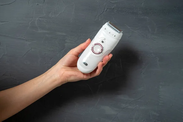 Electric Epilator White Color Woman Hand Gray Textured Background Means — Stock Photo, Image