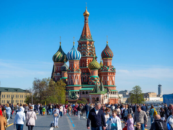 15.05.2021 Russia, Moscow. A lot of people are walking on the street near St. Basil's Cathedral. The end of quarantine, free walking