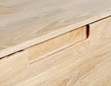 Drawers close view photo, wooden furniture elements background. Furniture details