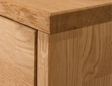 Drawers close view photo, wooden furniture elements background. Furniture details