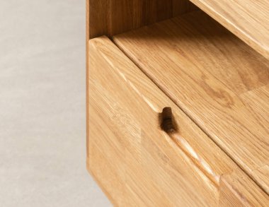 Drawers close view photo, wooden furniture elements background. Furniture details