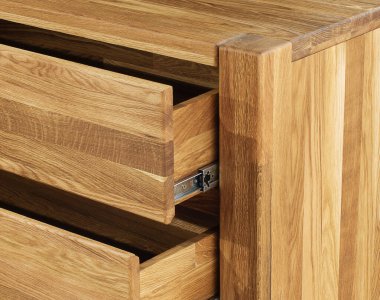 Opened wooden drawers with sliders close view photo, wooden eco furniture elements background. Solid wood furniture details