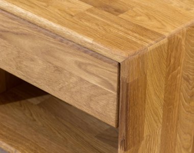 Wooden drawer of a nightstand close view photo, wooden eco furniture elements background. Solid wood furniture details
