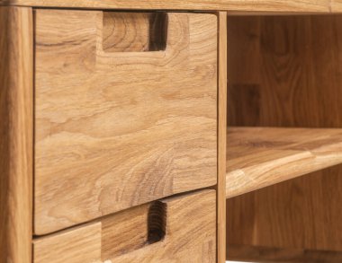 Table drawers with handles close view photo, wooden furniture background