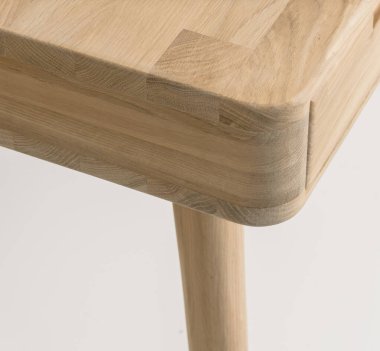Wooden table corner and leg close view photo, wooden eco furniture elements background. Solid wood furniture leg