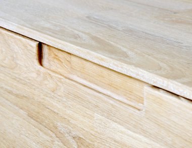 Drawers close view photo, wooden furniture elements background. Furniture details