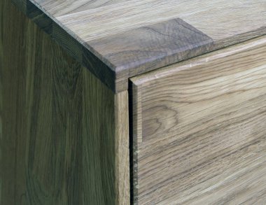 Wooden drawer close view photo, wooden eco furniture elements background. Solid wood furniture details