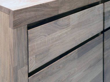 Wooden drawers close view photo, wooden eco furniture elements background. Solid wood furniture details