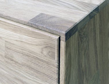 Wooden drawer close view photo, wooden eco furniture elements background. Solid wood furniture details