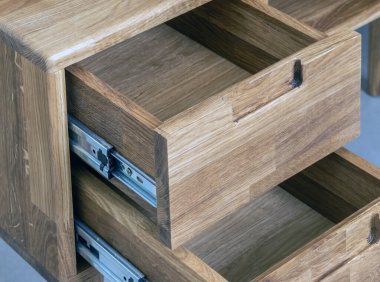 Opened drawers close view photo, wooden eco furniture elements background. Solid wood furniture details