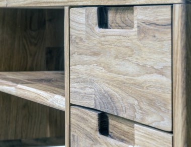 Table drawers with handles close view photo, wooden furniture background