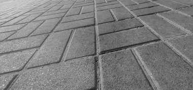 Tuğlaları, yol arka planı, yol yüzeyi yakın görüntüsü, siyah beyaz monokrom fotoğrafı