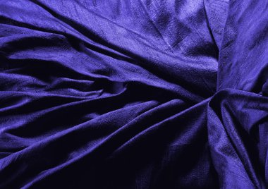 Koyu mavi parlak kumaş dokusu arka plan. Doğal tekstil materyali kapak resmi