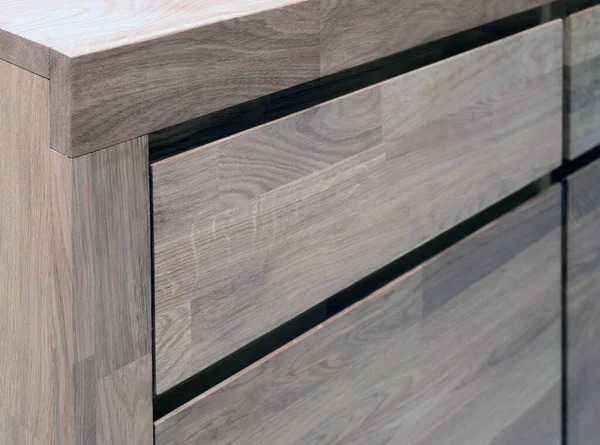 Wooden drawers close view photo, wooden eco furniture elements background. Solid wood furniture details