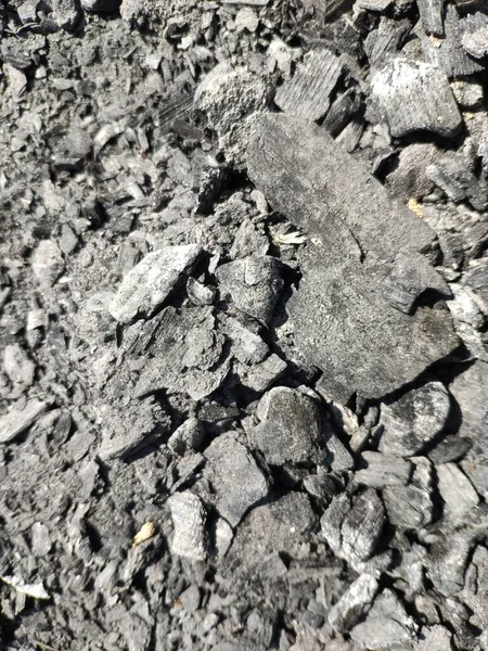 Kömür desenli yakın görüş arkaplanı. Kömür parçaları doku makro görünümü