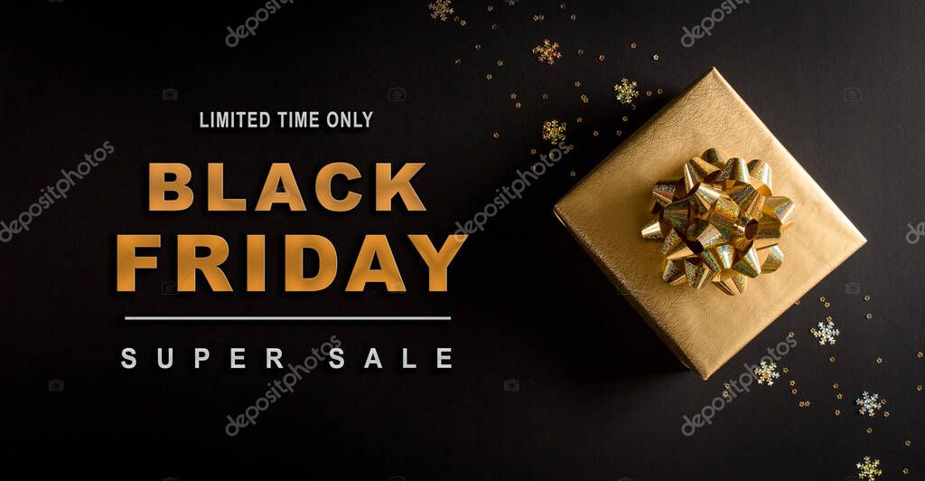 Top view of golden christmas gift boxes on black background with Black Friday text. Black Friday Sale, Banner, poster composition.