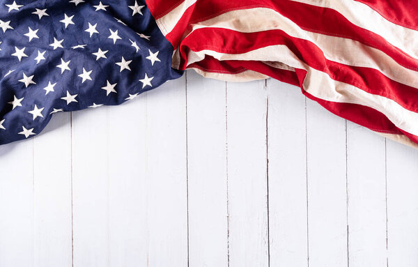 Happy memorial day concept made from american flag on white wooden background.