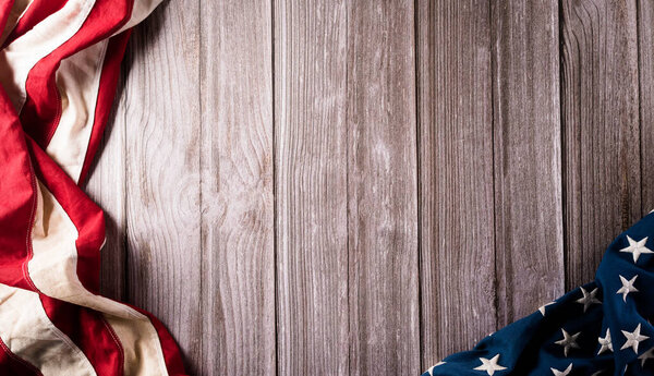 4th of July happy independence day concept. Vintage American flag on old wooden background.