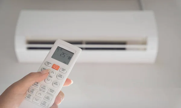 Hand Holding Remote Controller Directed Air Conditioner Room Set Ambient — Stock Photo, Image