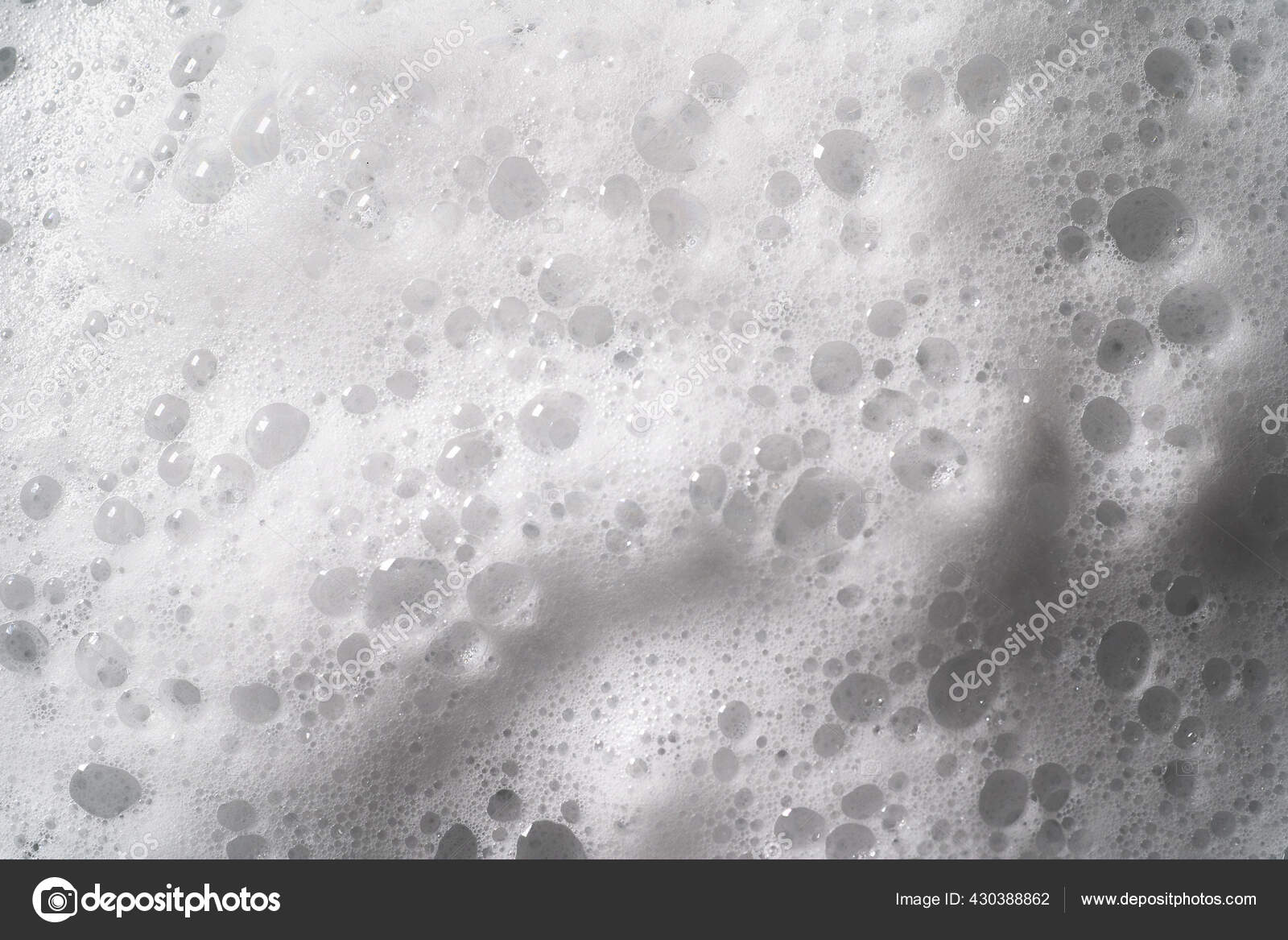 White foam with bubbles texture, soap, detergent or shampoo or cleanser  surface, macro shot. Body care concept Stock Illustration by ©DedMityay  #430388862