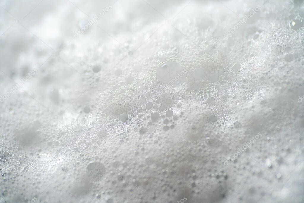 Foam bubbles from soap or shampoo, top view macro photography