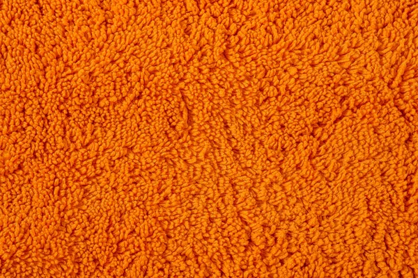 Orange Mikrofasertuch Oberflächentextur Hintergrund, spezielles Handtuch für die Hausreinigung, Feuchtigkeitsabwischen, Autotrocknen und Polieren — Stockfoto