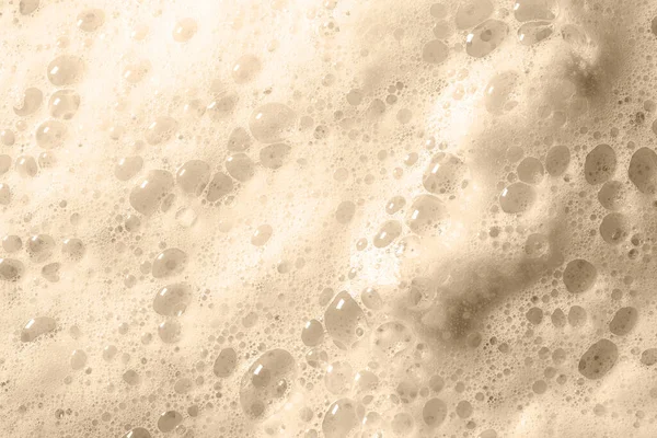 Pěna bublina z mýdla nebo šampon praní tónované v Sailu Champagne barva trendy kreativní design barva 2021 — Stock fotografie