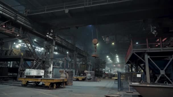 Interior of large workshop of metal processing plant with machine tools and moving industrial crane — Stock Video