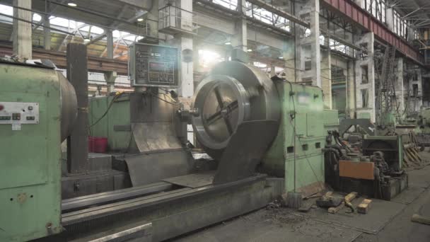 Lathe machine in factory, boring of part with milling tool. Metalworking machine grinds tube metal product — Stock Video