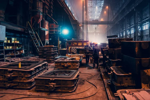 Metallurgical plant. Industrial steel production. Interior of metallurgical workshop inside with workers. Steel mill factory. Heavy industry foundry