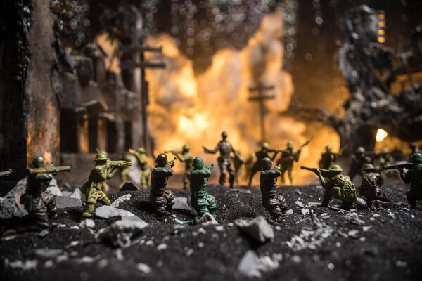 War Concept. Military silhouettes fighting scene on war fog sky background, World War Soldiers Silhouette Below Cloudy Skyline At night. Battle in ruined city. Selective focus